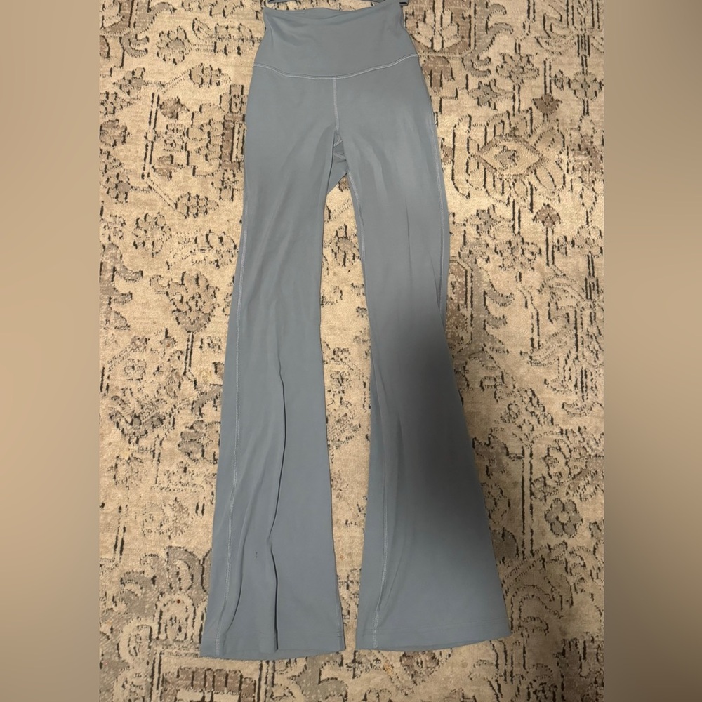 Light blue Lululemon flared leggings has matching sports bra on page
